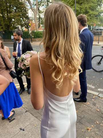 Bride civil wedding hair, loose beachy curls, wearing white silk dress