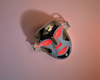 dr_dennis_gross_led_mask red mode on pink backgorudn 